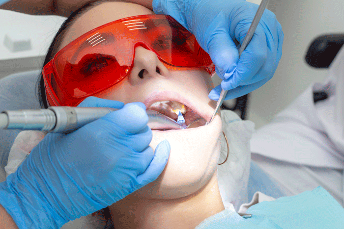 girl-examination-dentist-treatment-carious-tooth